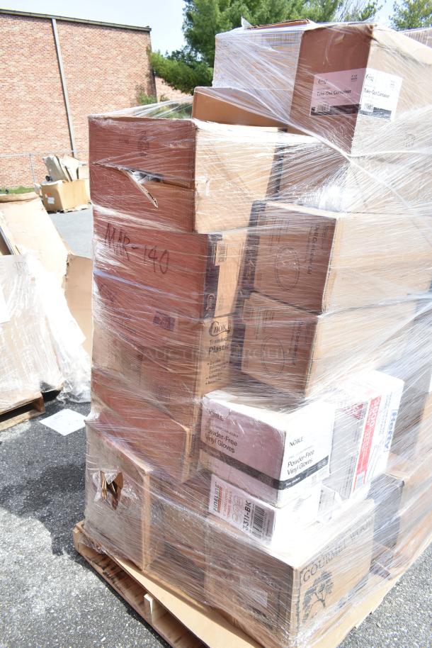 Pallet with assorted scratch and dent items, including wood logs, containers, cold cups, napkins, wrapped in plastic.