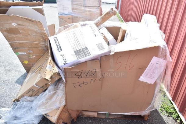 Cardboard box with visible markings showing "872 Feb19-01" containing various kitchen items like souffle cups and a stock pot. Boxes labeled "Karat" with portion cups are visible. Items are new scratch and dent.