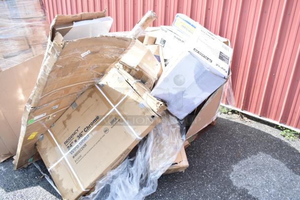 Boxes of scratch and dent items, including souffle cups, stock pot, and colander, partially opened and stacked outdoors.