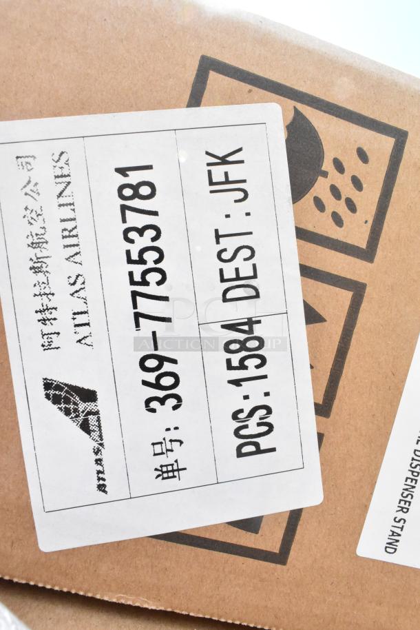 Brown shipping box with label markings indicating "Atlas Airlines" and destination "JFK."