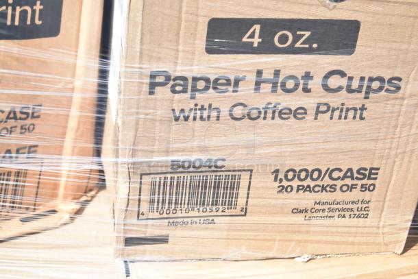 Cardboard box labeled "4 oz. Paper Hot Cups with Coffee Print," containing 1,000 cups per case. Made in USA.