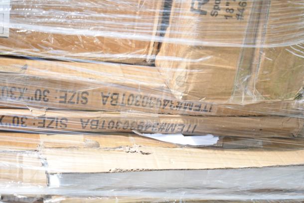 Packaged scratch and dent items including tabletops, wire shelf, and sink. Visible box labels show item size and codes.