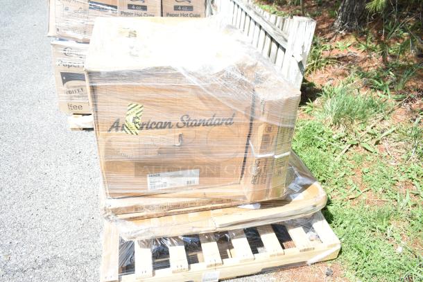 Six brand new scratch and dent items including tabletops, wire shelf, sink, packaged on pallets. Boxes labeled "American Standard."