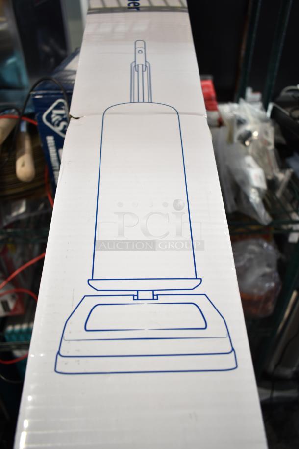 Alt text: Lavex 12" Upright Bagged Vacuum Cleaner box with scratch and dent. Model 457LWVAC12, new condition.