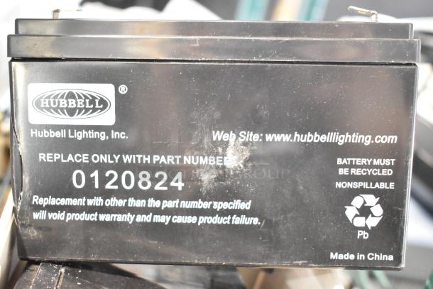 Hubbell Lighting battery with label details including part number 0120824. "BATTERY MUST BE RECYCLED" and "Made in China".