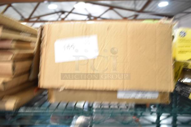 Cardboard box labeled "165" containing a lot of various items including Texas-themed paraphernalia, pins, a spoon, and shot glasses.