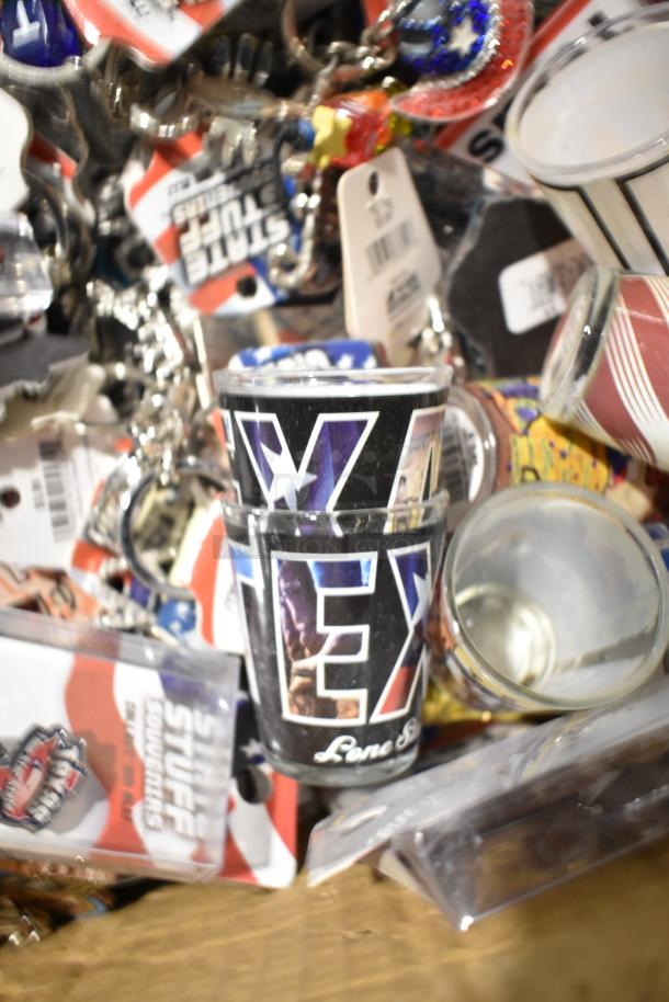 Lot of Texas-themed items including pins, spoon, shot glasses with "Lone Star" text. Assorted condition, tags visible.