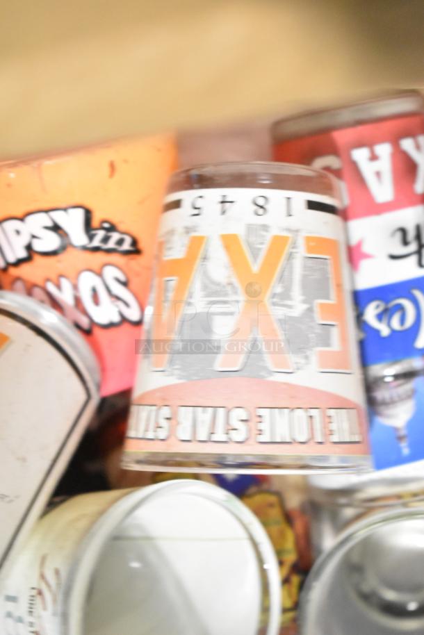 Lot of Texas items, including shot glasses with "TEXAS" and "LONE STAR STATE" labels; condition appears well-used.