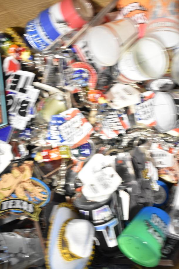 Lot of Texas-themed items including pins, spoon, shot glasses; assorted condition; features Texas memorabilia and collectibles.