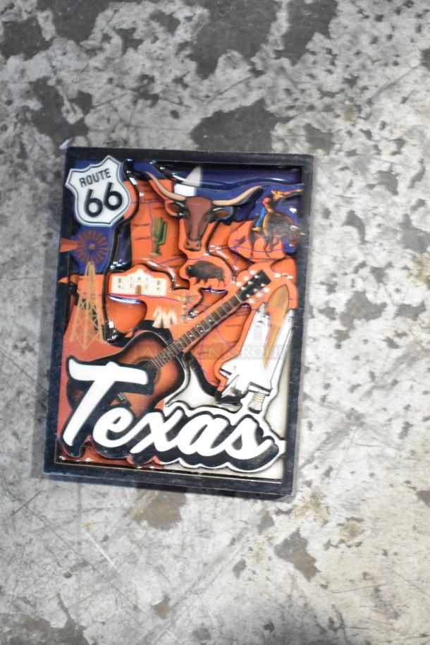 Lot featuring Texas-themed items, including Route 66 memorabilia with guitar and bull imagery, displayed in good condition.
