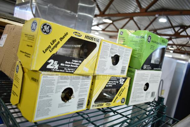 GE high beam light boxes, models H5051, H5054, in original packaging, long-life, auction lot of 6 items.