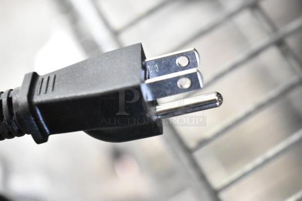 Close-up of a standard 120V plug for the Galaxy 177RCSG60 electric rice cooker. Cord is black and in new condition.