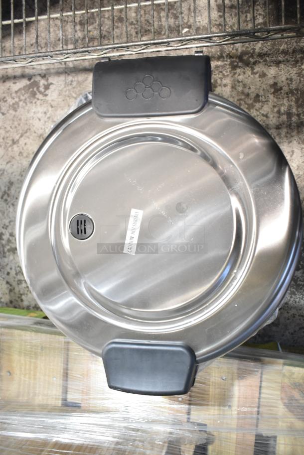 Brand new Galaxy 177RCSG60 electric rice cooker, 60 cup capacity, stainless steel lid with "Caution Hot Surface" label, 120V.