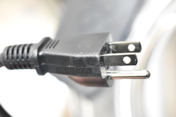 Close-up of a plug from the Galaxy 177RCSG60, a 2024 countertop 60 cup electric rice cooker/warmer. 120 Volts, 1 Phase.
