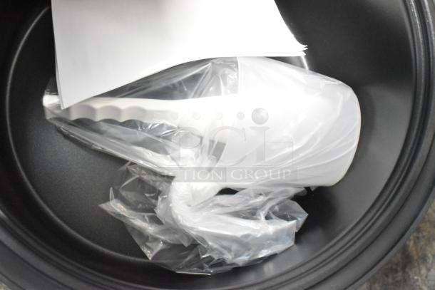 Brand new 2024 Galaxy 177RCSG60 rice cooker inside view, includes manuals and accessories in plastic packaging.