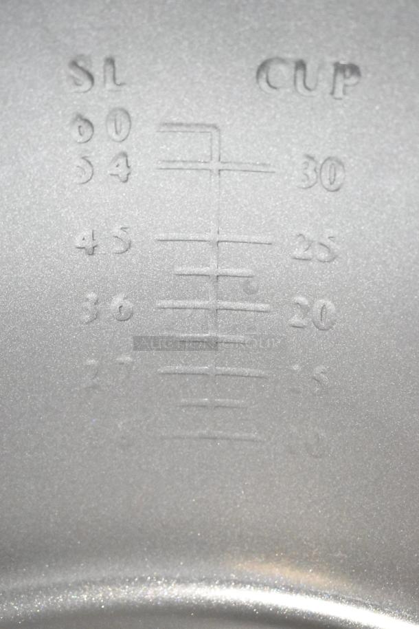"Inside view of Galaxy 177RCSG60 rice cooker with embossed measurement markings showing cup levels for 60, 54, 45, 36, 27."