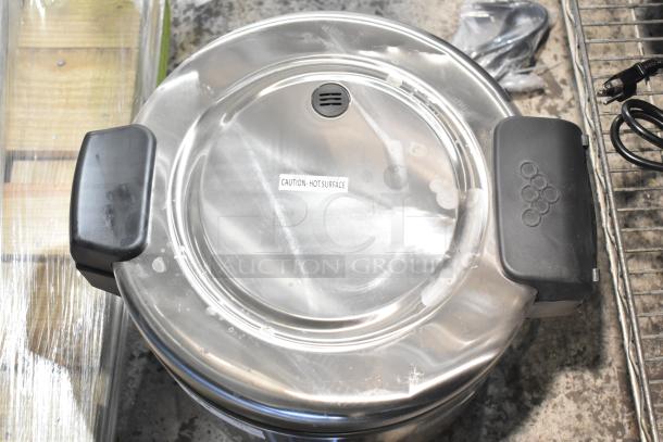 Brand new Galaxy 177RCSG60 countertop electric rice cooker/warmer, 60 cup capacity, 120V, with "Caution - Hot Surface" label.