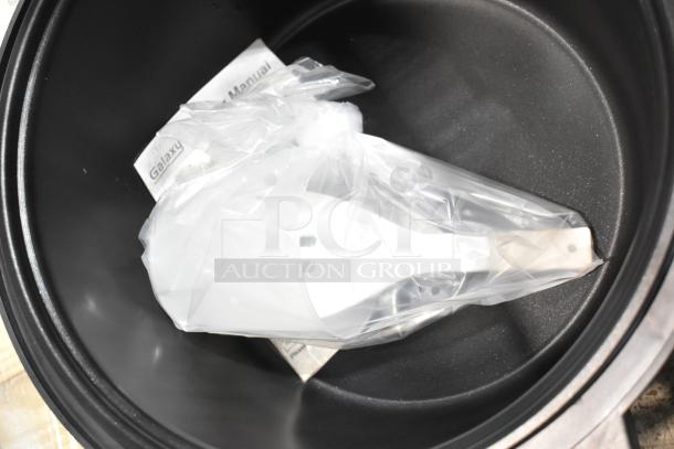 BRAND NEW Galaxy 177RCSG60 countertop rice cooker/warmer, 60-cup capacity, includes manual and accessories in packaging.