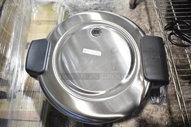 Brand new Galaxy 177RCSG60 countertop rice cooker/warmer, 60-cup capacity, 120V, scratch and dent condition, labeled "Caution: Hot Surface."