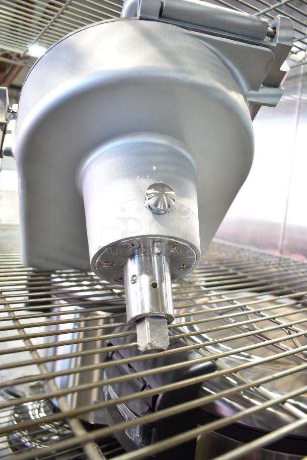 Commercial Pelican Head with grating blade, metallic finish, mounted on metal grill rack, suitable for food processing.