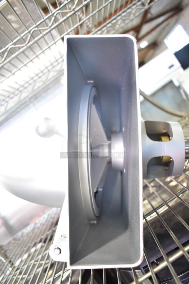 Commercial pelican head with grating blade, featuring metal construction, visible grating mechanism, in good condition.