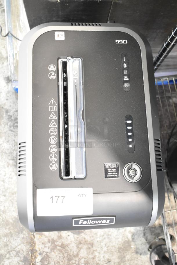 Fellowes CRC 32299 paper shredder, 120 volts, 1 phase, black and gray design, visible model markings, and control symbols.