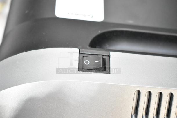 Fellowes CRC 32299 paper shredder's power switch detail, black and silver design, 120 volts, 1 phase.