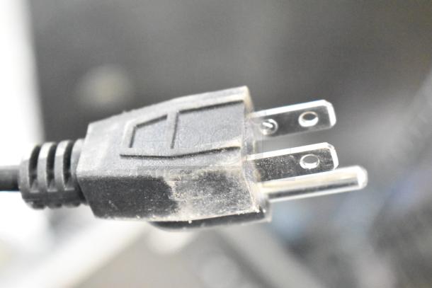 Fellowes CRC 32299 paper shredder power plug, showing 120 volts, 1 phase compatibility. Dust visible on plug surface.