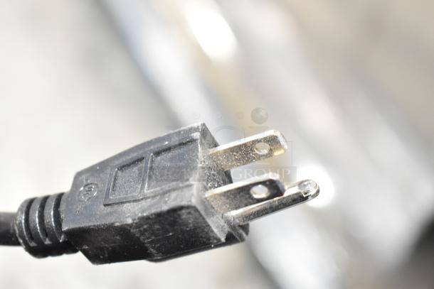 Close-up of a plug for the 2025 Bunn GVH Commercial Coffee Bean Grinder, 120V, 1 Phase. Black plastic, three-prong design.