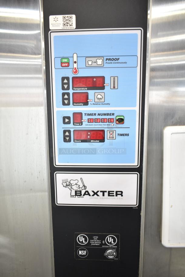 Baxter PC101-M28 commercial roll-in rack unit, showing control panel with temperature, humidity, and timer settings. Labels include UL, NSF. 208/240V, 1 Phase.
