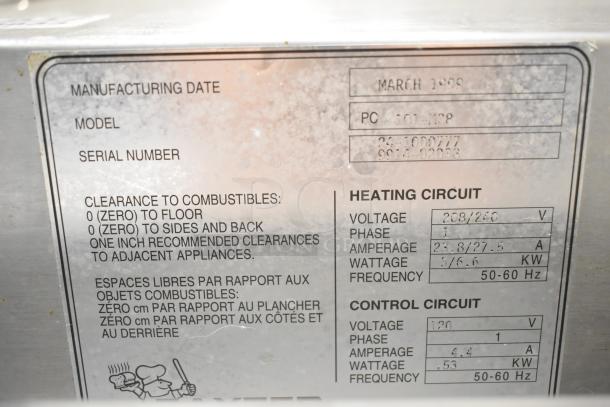 Baxter PC101-M28 Commercial Roll In Rack Unit label showing manufacturing date, model, and electrical specifications.