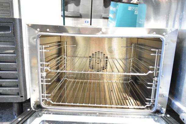 2025 Cadco Unox Anna XAF023-US stainless steel convection oven, electric, 208-240V, 1 Phase. Open door view of racks.