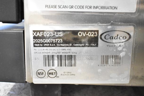 Cadco Unox Anna XAF023-US convection oven label showing model, serial number, voltage, and certifications.