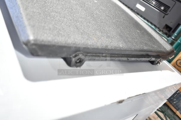 Avantco commercial ice machine, scratch and dent, black textured panel, visible scuff marks, new condition, self-contained.