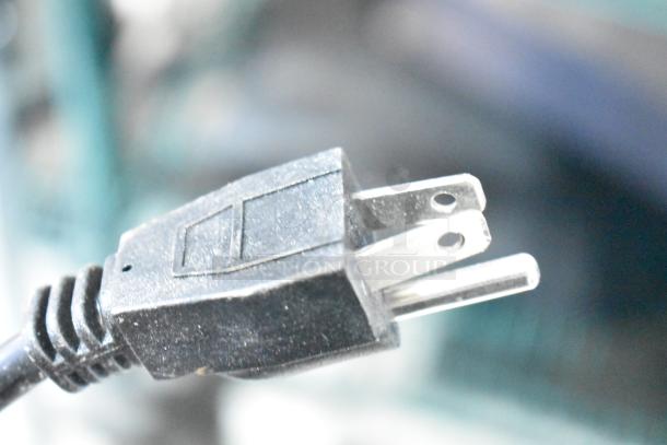 Avantco ice machine power plug close-up, showing a standard three-prong plug. Item is brand new with minor scratches.