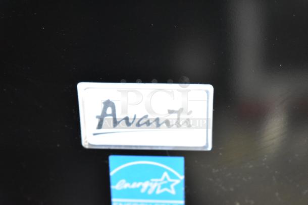 Avanti RM3316B Mini Cooler label, showing brand logo and Energy Star certification on black surface.