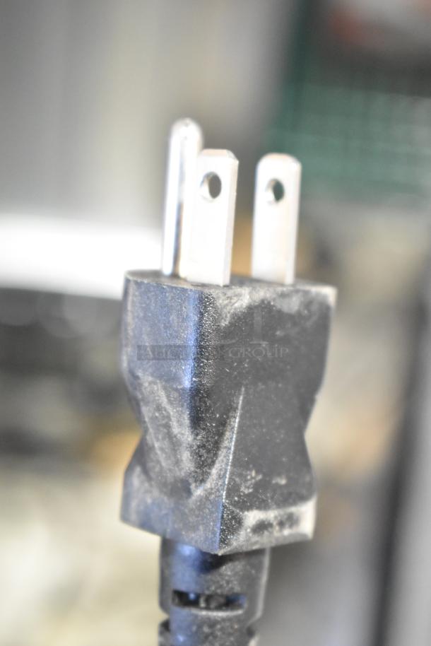 Close-up of dusty power plug for Avanti RM3316B Mini Cooler, 115 Volts, 1 Phase.