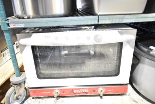 Brand new Avantco 177CO16 half-size countertop convection oven, 1.5 Cu. Ft., 120V, 1 Phase, shows minor scratches.