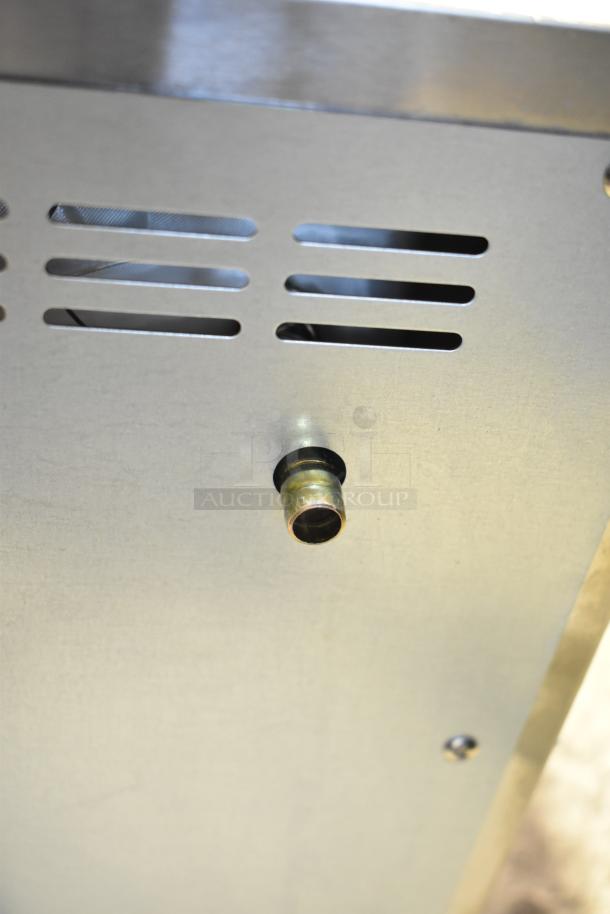 Alt text: Vent detail on Avantco 177CO16 half-size countertop convection oven, showcasing exterior design and metal finish.