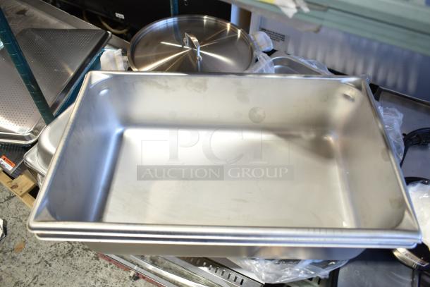 14 piece lot of new scratch and dent kitchen pans, featuring stainless steel and aluminum anti-jam steam and bun pans.