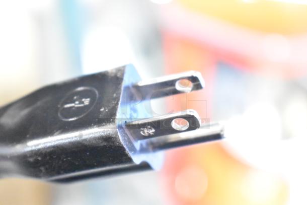 Close-up of a plug for the AvaMix Retro Red Drink Mixer, model 928RDM1RD, showing standard prongs.