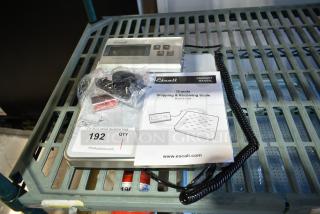 Brand new Escali 120S countertop scale with manual. Features visible controls. Includes accessory bag and a scratch and dent note.