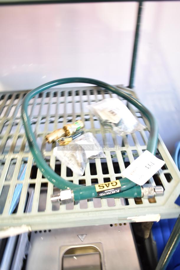 Brand new Krowne M5072K 72" mobile gas connector hose kit, 1/2", with fittings, labeled "GAS". Scratch and dent condition.