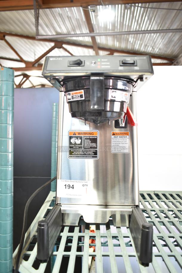Brand new Bunn 39900.0006 SmartWAVE 15-S-APS airpot coffee brewer, 120V, scratch and dent condition, warning labels visible.