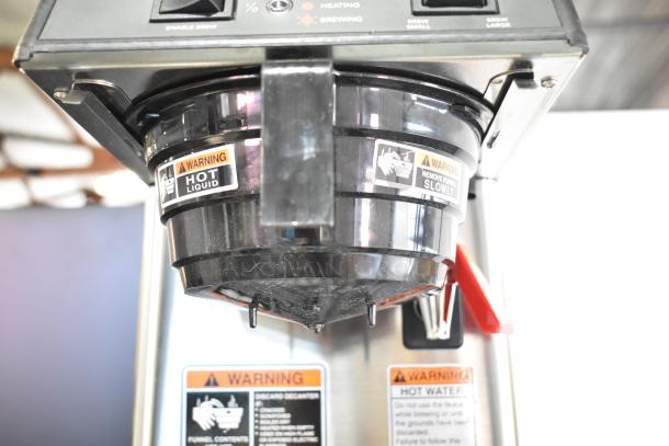 Brand new Bunn 39900.0006 SmartWAVE coffee brewer, showing labels warning of hot liquid; low-profile automatic model.