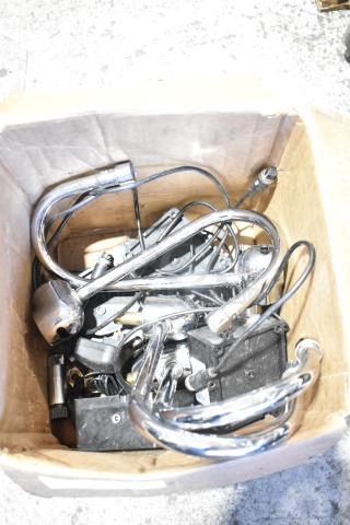 Box containing 8 various items, including 020237-45 power unit. Features metallic parts and cables, showing moderate wear.