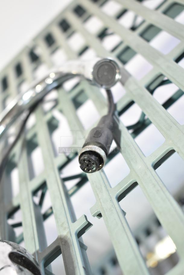 Assorted items, including a 020237-45 power unit, displayed on a metal grid. Clean condition, suitable for various applications.