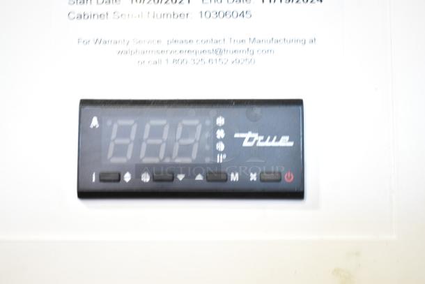 2021 True TSCI-600R-G-PH commercial cooler control panel with digital display. Model info and warranty contact details shown.