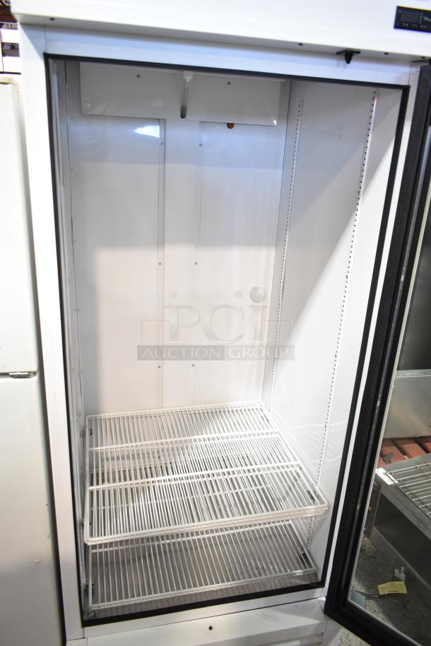 2021 True TSCI-600R-G-PH commercial cooler, single glass door, 115V, 1 phase. Clean interior, wire shelving.