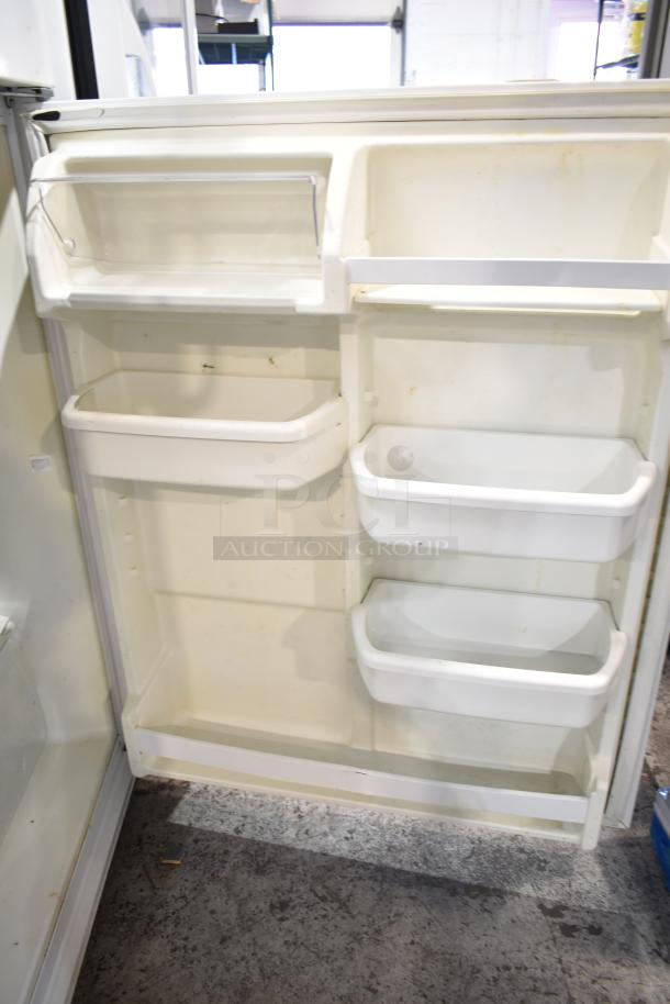 Whirlpool ET1MHKXMQ08 Reach-In Cooler with Freezer, 115V, 1 Phase. Visible interior shelves, moderate wear. Clean exterior.